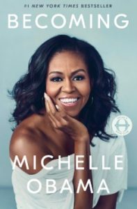 Cover of Becoming by Michelle Obama, featuring a portrait of Obama with a warm smile.
